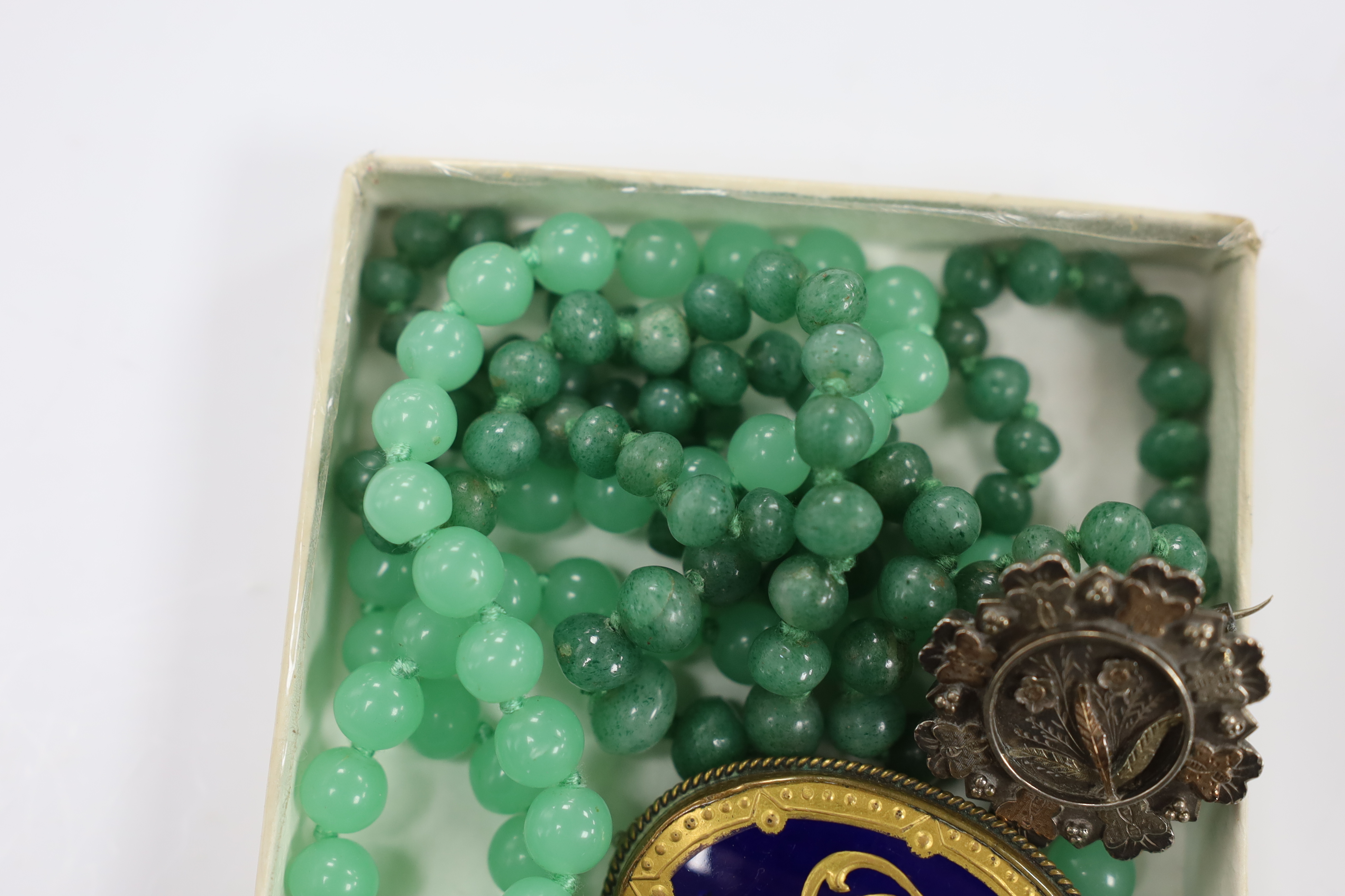 Sundry jewellery etc. including two simulated jade necklaces, a late Victorian silver brooch, a silver compass fob on a silver albert and an Art Nouveau style enamelled white meal drop pendant.